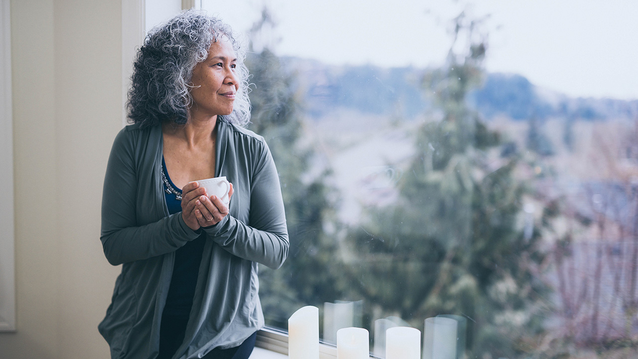 Elder woman drinking a cup of coffee