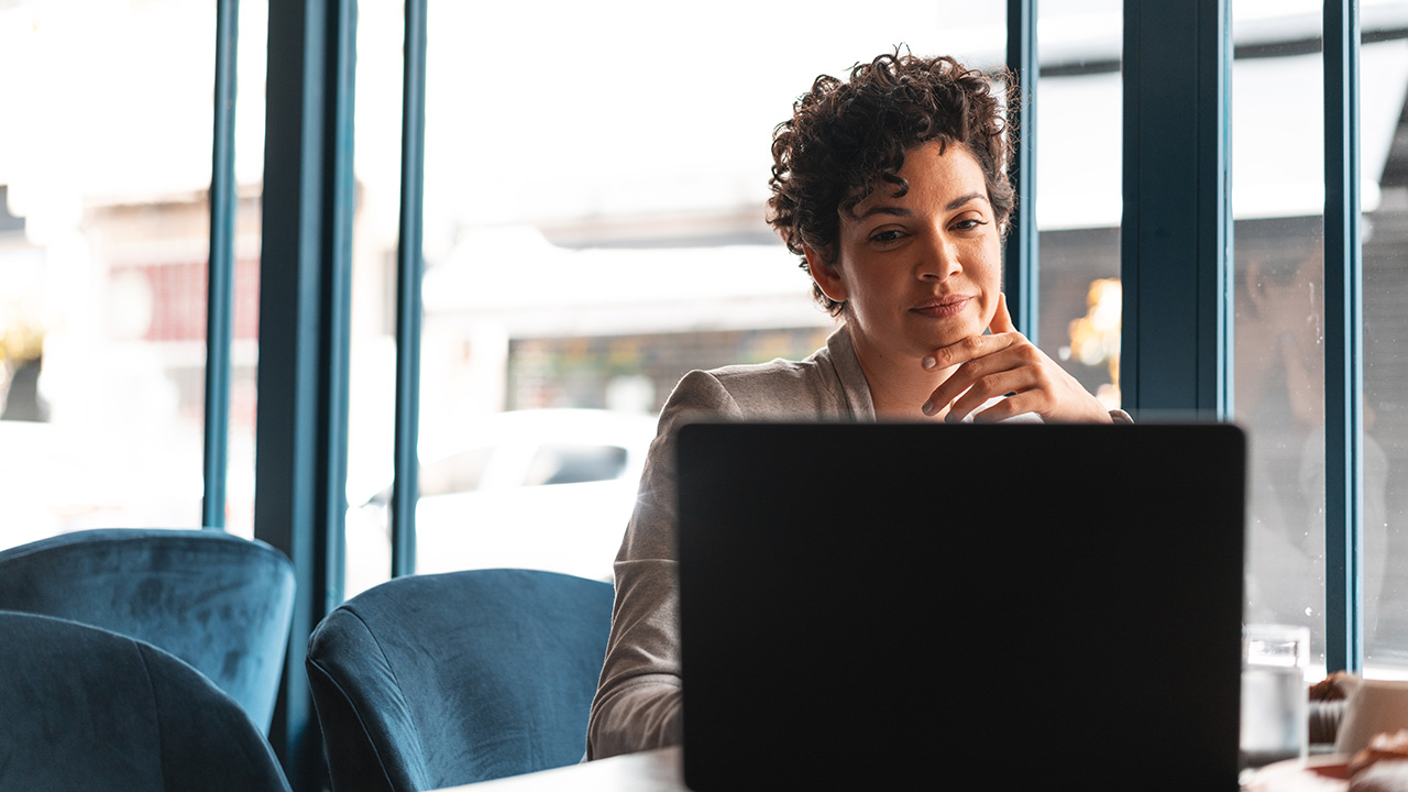 Woman looking on her laptop